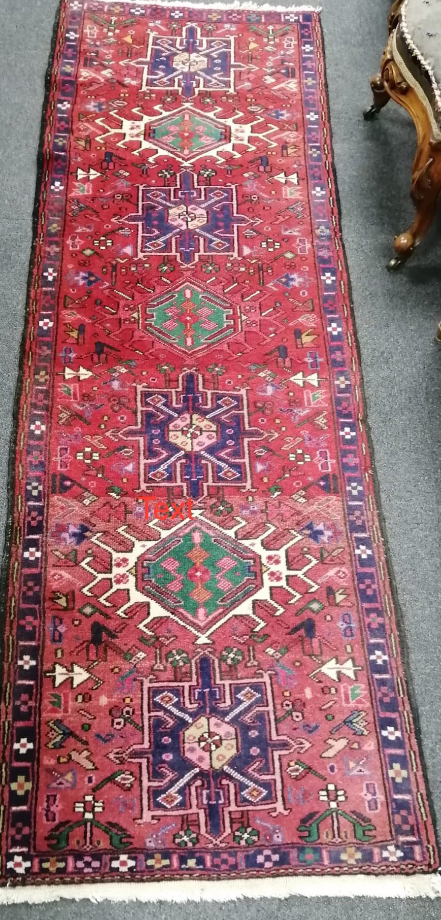 A Caucasian red ground rug, 160 x 100cm and similar runner